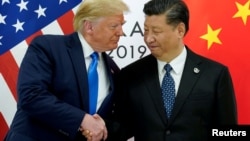 Президент США Дональд Трамп и лидер Китая Си Цзиньпин на саммите G20 в Осаке (Япония). 29 июня 2019 года.