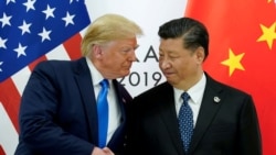 Дональд Трамп приветствует Си Цзиньпина на саммите G20 в Осаке, Япония. 29 июня 2019 года.