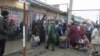 People wait to cross the Uzbek-Kyrgyz border on March 25. The border areas in Central Asia have been subject to recurring disputes since the collapse of the Soviet Union in 1991.