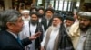 Russian special envoy to Afghanistan Zamir Kabulov (left) speaks with Mullah Abdul Ghani Baradar, the Taliban's top political leader (third left) and other members of the hard-line Islamist group in 2019.
