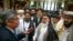 Russian presidential envoy to Afghanistan Zamir Kabulov (left) speaks to Mullah Abdul Ghani Baradar, the Taliban group's top political leader (third left) and other members of the Taliban in Moscow in 2019.