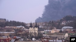 Ukraine - Smoke rises the air in Lviv, western Ukraine, Saturday, March 26, 2022.