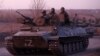 An armored convoy of pro-Russia troops travels on a road leading to the besieged Ukrainian port city of Mariupol on March 28. 