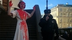Russian Artist Doused In Fake Blood Protests Against War