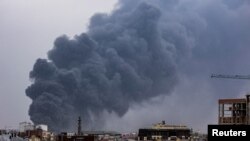 Smoke rises after an air strike on the western Ukrainian city of Lviv on March 26.