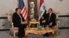 U.S. Secretary of State Mike Pompeo (left) talks with Iraqi Foreign Minister Muhammad Ali al-Hakim in Baghdad on January 9.