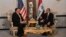 U.S. Secretary of State Mike Pompeo (left) talks with Iraqi Foreign Minister Muhammad Ali al-Hakim in Baghdad on January 9.