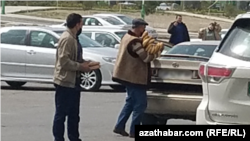 Turkmenistan. Man with hands full of bread. March, 2022