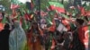 Supporters of Prime Minister Imran Khan's ruling Pakistan Tehrik-e Insaf (PTI) party attend a rally in Islamabad on March 27.
