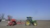A Ukrainian farmer drives a tractor as he works in a field in Izmail on March 24. The fate of the war in Ukraine is currently being played out in the east of the country, but the food security of tens of millions of people around the world depends on the sowing of Ukrainian crops which has begun in the west and south, areas that are relatively sheltered from the fighting.