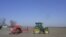 A Ukrainian farmer drives a tractor as he works in a field in Izmail on March 24. The fate of the war in Ukraine is currently being played out in the east of the country, but the food security of tens of millions of people around the world depends on the sowing of Ukrainian crops which has begun in the west and south, areas that are relatively sheltered from the fighting.