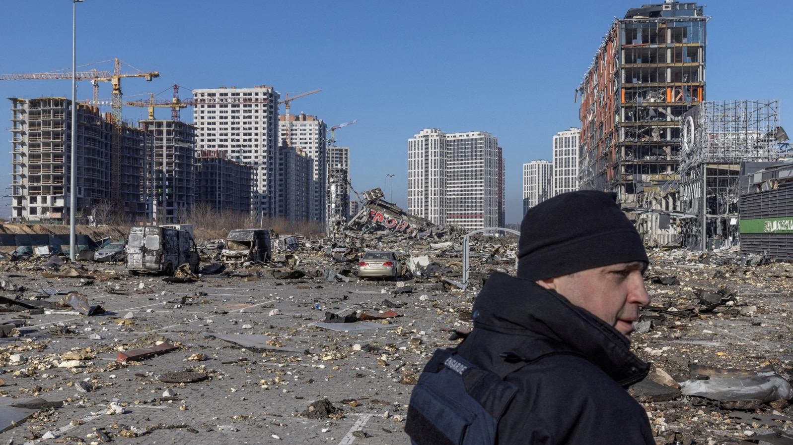 UKRAINE - Ukrainian serviceman secures the site of a bombing at a shopping center, in Kyiv, March 21, 2022