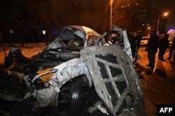 У машынах, што загарэліся пасьля выбуху бомбы, былі людзі