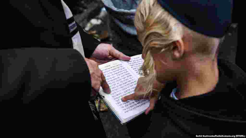 Pilgrims read Hebrew prayers during the celebrations.