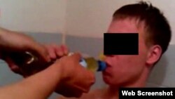 A screen shot from one of a series of homophobic videos posted on the Internet appears to show a young Russian gay man being forced to drink urine.