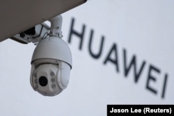 A surveillance camera is seen outside Huawei's factory campus in Dongguan, China.