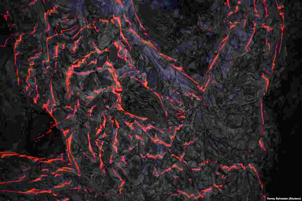 Lava flows on the outskirts of Pahoa during ongoing eruptions of the Kilauea volcano in Hawaii. (Reuters/Terray Sylvester)