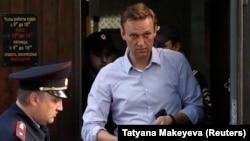 Russian opposition leader Aleksei Navalny leaves after a court hearing in Moscow last month.