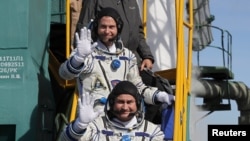 U.S. astronaut Nick Hague and Russian cosmonaut Aleksei Ovchinin board the Soyuz MS-10 spacecraft for the launch at the Baikonur Cosmodrome, Kazakhstan, on October 11.