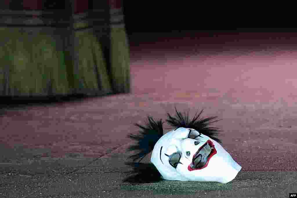 The mask of the jester Rigoletto lays on the ground during a rehearsal. 