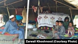 A Mosuli family rests in their traditional tent near Khost city.