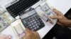 IRAN -- A close up shot shows Iranians trading money at a currency exchange office in a shopping centre in the capital Tehran, April 10, 2018