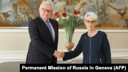 Russian Deputy Foreign Minister Sergei Ryabkov (left) and U.S. Deputy Secretary of State Wendy Sherman shake hands at the start of talks in Geneva on September 30.