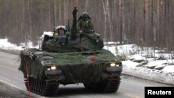 A Swedish Army tank takes part in a military exercise called Cold Response 2022, which saw around 30,000 troops gather from NATO member countries as well as Finland and Sweden, on March 25.
