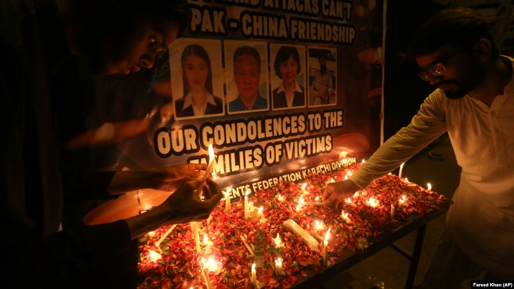 Mourners pay tribute at Karachi's Confucius Institute on April 28 to those killed by a suicide bomber. 