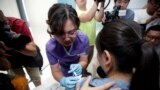 A woman from Beijing receives an injection of the Gardasil 9 human papillomavirus (HPV) vaccine, which, according to local media, is the first in mainland China, at a hospital in Boao, Hainan province, China May 30, 2018.