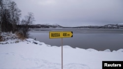 Знак у границы Норвегии с Россией.