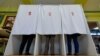 Hungarians vote in a polling station in Miskolc on April 3.