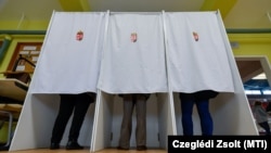 Hungarians vote in a polling station in Miskolc on April 3.
