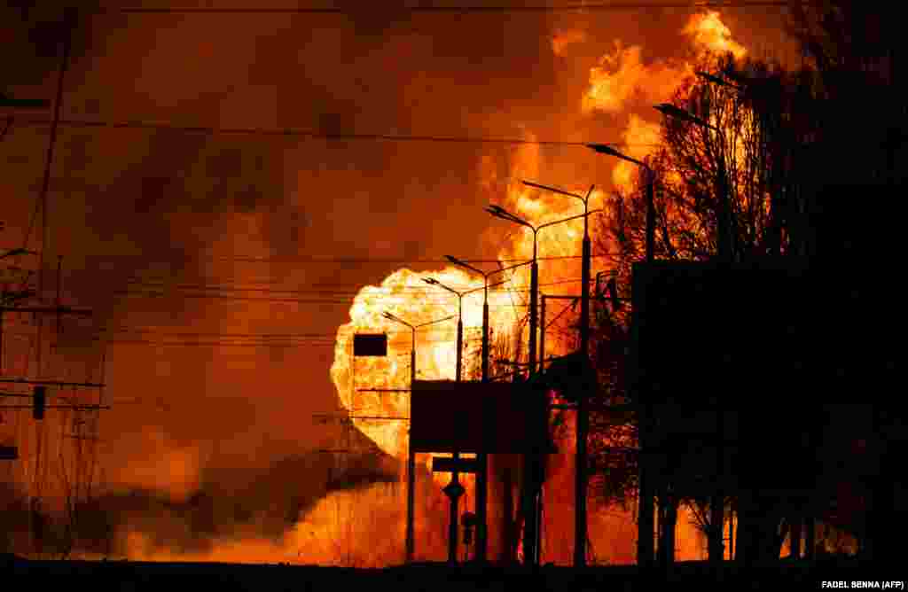 A gas station burns after Russian attacks on the Ukrainian city of Kharkiv on March 30. 