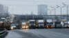 Russia -- A road police officer blocks off the traffic on the Moscow Ring Automobile Road (MKAD) on the suburbs of Moscow, December 4, 2015