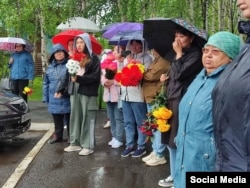 Mourners attend the funeral of a local Tura man killed in Russia's war against Ukraine.