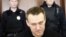 Russian opposition leader Aleksei Navalny (center) at his appeal hearing in Moscow City Court on March 30.