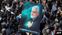 Iranian mourners gather during the final stage of funeral processions for slain commander Qassem Soleimani, in his hometown of Kerman on January 7, 2020. 