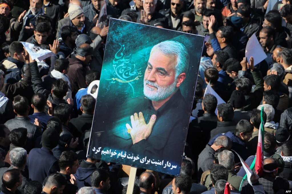 Iranian mourners gather during funeral processions for General Qasem Soleimani in his hometown of Kerman on January 7, 2020.