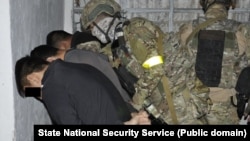 The Kyrgyz State Committee for National Security said the suspects were apprehended in the town of Kerben.