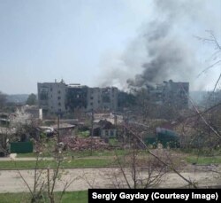 Наслідки обстрілу житлового масиву Попасної