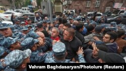 ARMENIA - Police officers restrain participants of an anti-government demonstration in Yerevan, May 3, 2022.