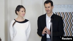 Syria's President Bashar al-Assad and his wife, Asma 