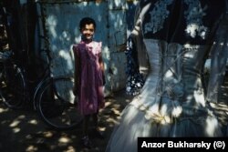 A girl pauses for a photo in the bazaar in Khiva.