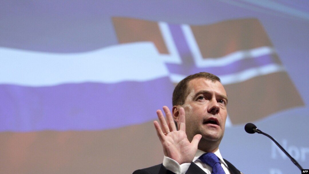 Russian President Dmitry Medvedev speaks at a business seminar. The Russian flag -- rather than the Freedom Forum banner -- is taking center stage in Oslo.