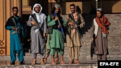 Taliban fighters stand guard outside a mosque during Eid al-Fitr prayers in Kabul. (file photo)