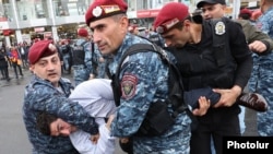 Armenia - Riot police arrest an opposition protester in Yerevan, May 2, 2022.