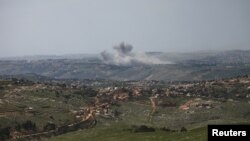 Smoke rises in Lebanon following Israeli strikes, as seen from the Israeli side of the Israel-Lebanon border on April 26.