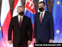 Polish Prime Minister Mateusz Morawiecki (right) with Viktor Orban in Krakow last month