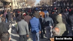Anti-government protesters march in Hamedan in western Iran on January 8. 